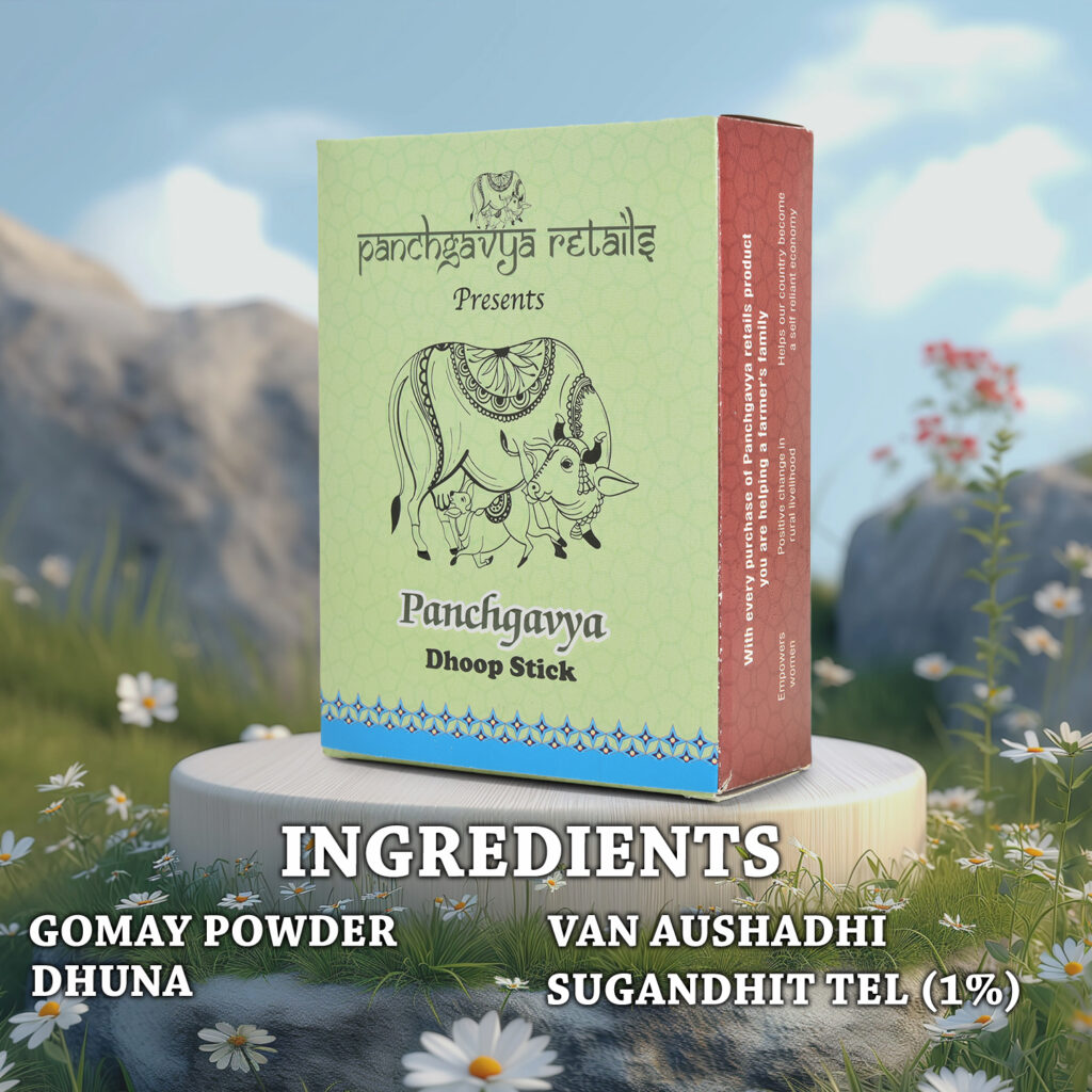Box of Panchgavya Dhoop Stick placed on a wooden platform in a natural outdoor setting with flowers and mountains in the background. Ingredients include Gomay Powder, Dhuna, Van Aushadhi, and Sugandhit Tel (1%).